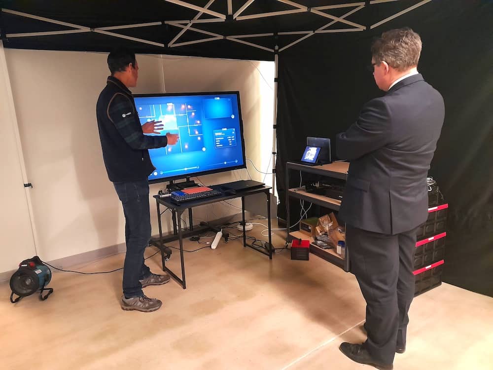 Matthew Harrison – Chief Financial Officer & Retired Captain RM (Left) and MinDP Jeremy Quin discuss performance monitoring technology for troop commanders