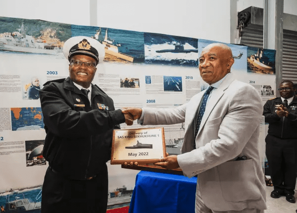 From right to left: DSCT Board Member, Mr Sam Montsi, hands over a delivery token to Vice Admiral Mosuwa Samuel Hlongwane, Chief of South African Navy