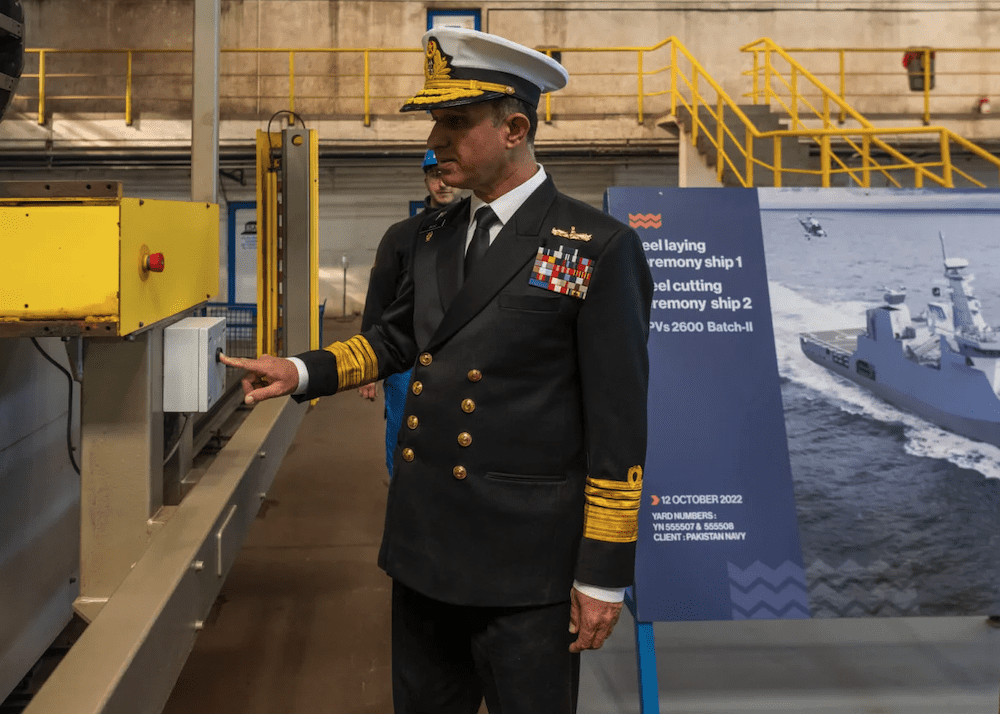 Chief of the Naval Staff Admiral Muhammad Amjad Khan Niazi engages the steel cutting machine at Damen Shipyards Galatí