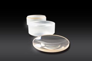 Aspherized Achromatic Lenses